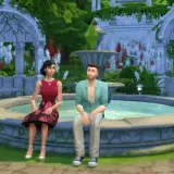 Para dowiedzieć się, jak zmienić relacje między simami w The Sims 4, zobacz tę parę siedzącą przy fontannie w ogrodzie.