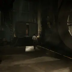 Kate Walker wchodzi do mrocznego, industrialnego pomieszczenia. Ten widok to fragment poradnika do Syberia 2.