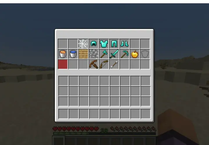 Ekwipunek gracza Minecraft: diamentowa zbroja, miecz, kilof, łuk, strzały i złote jabłko. Idealny zestaw na lepsze PvP.
