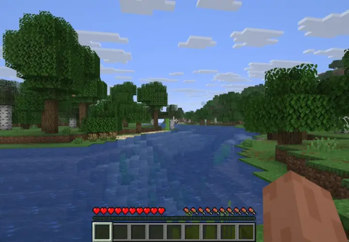 Piękny krajobraz w Minecraft, idealny na nowe przygody. Woda, drzewa i chmury tworzą wspaniałe seedy do Minecrafta.