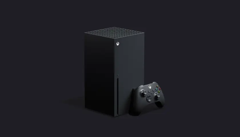 Czarna konsola Xbox Series X i kontroler na ciemnym tle. Premiera nowej generacji gier.