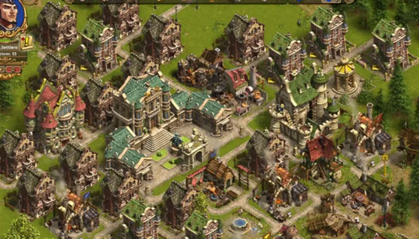 Widok z gry settlers online: rozbudowana osada z wieloma budynkami, ścieżkami i zielenią.