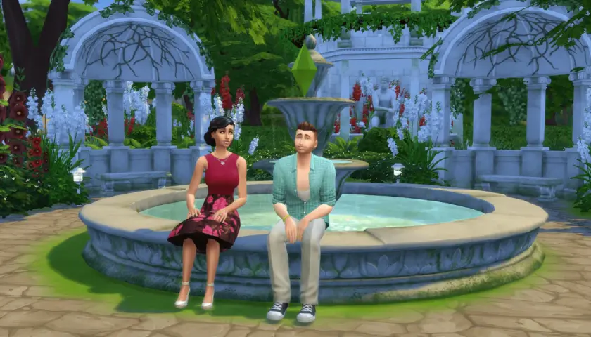 Para dowiedzieć się, jak zmienić relacje między simami w The Sims 4, zobacz tę parę siedzącą przy fontannie w ogrodzie.