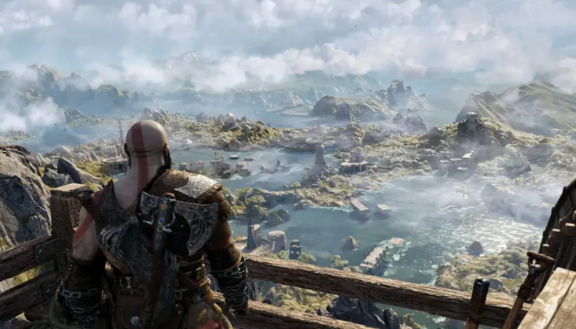 Kratos spogląda na rozległy, mglisty krajobraz. Zastanawiasz się, ile trwa fabuła God of War Ragnarök, przemierzając te krainy.