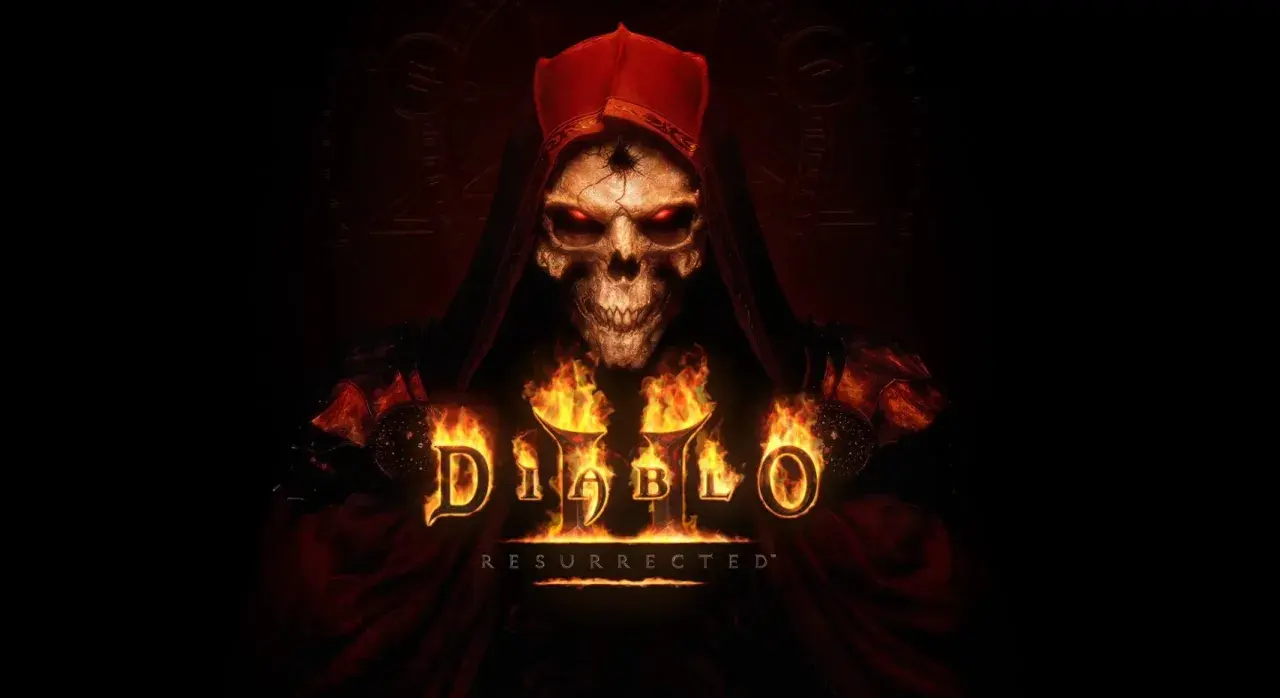Diablo II Resurrected: przerażająca czaszka w czerwonym kapturze, otoczona płomieniami, z logo gry.