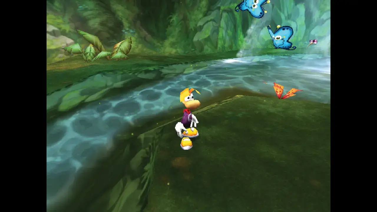 Rayman 2: Przygoda w zielonej krainie. Rayman stoi nad wodą, otoczony przez motyle i bujną roślinność.